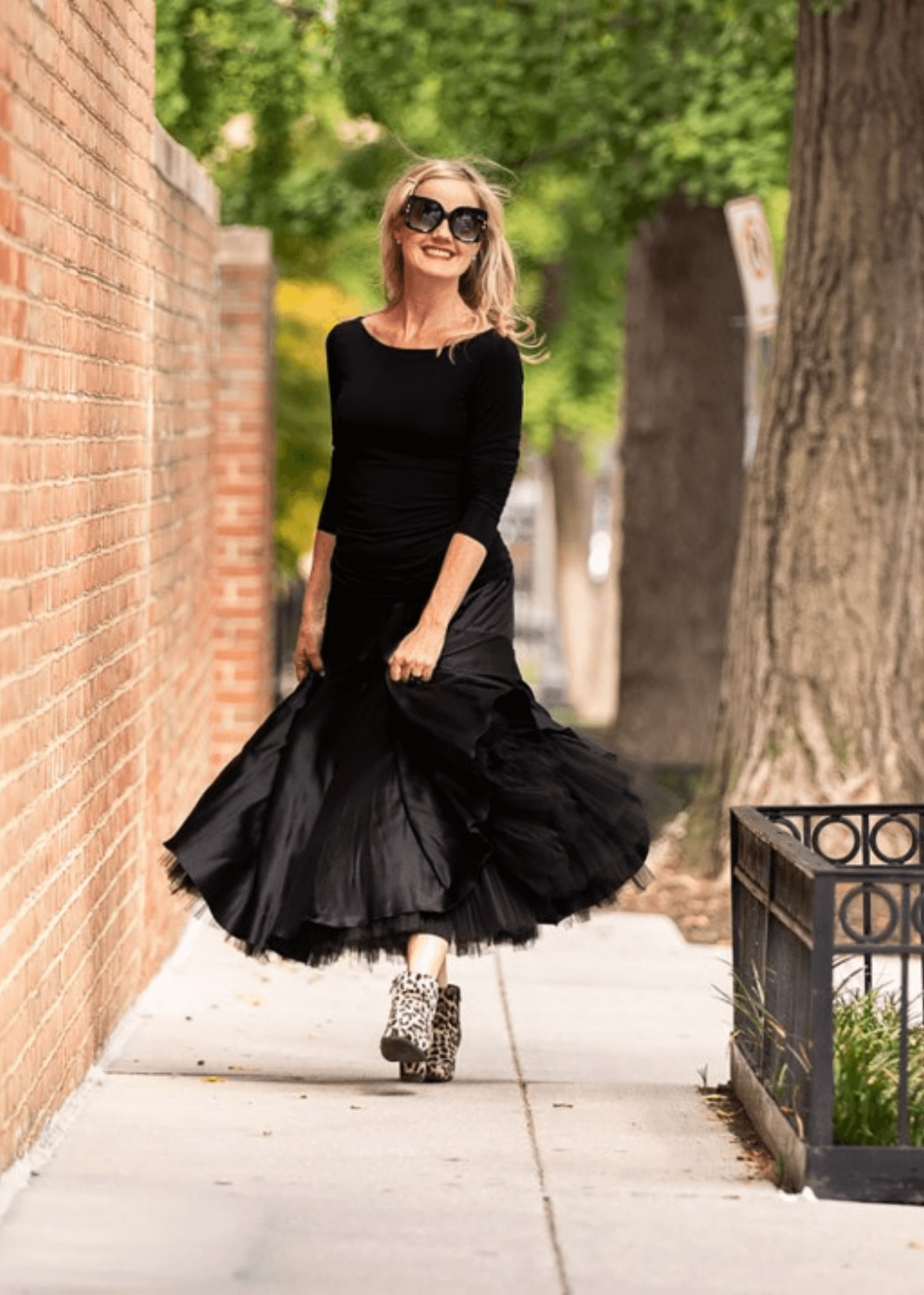 Kimberly black dress walking outside