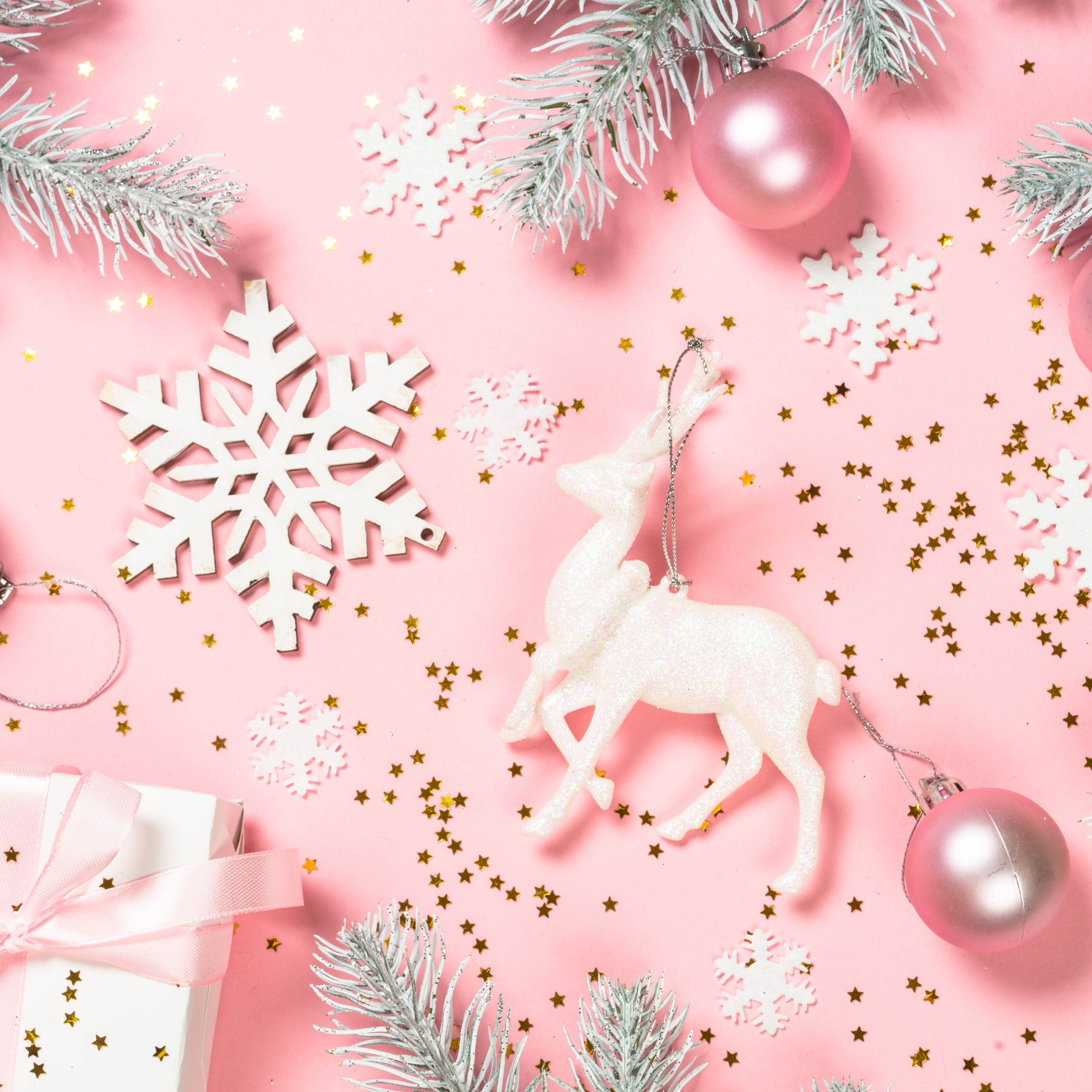 Pink flatlay of Christmas decorations